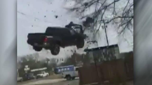 Truck takes flight in dramatic end to police pursuit
