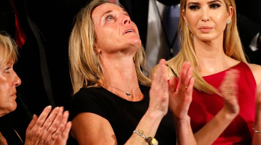 Navy SEAL's widow receives emotional standing ovation