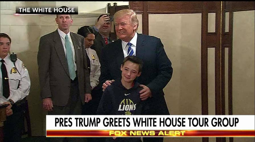 Trump greets visitors