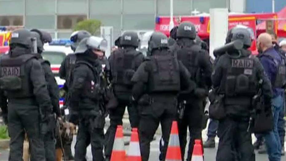 Suspected terrorist attacks airport in Paris