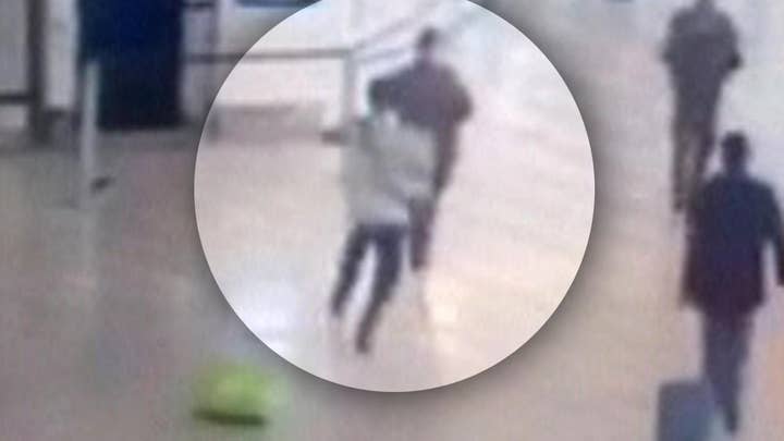 Moment man takes soldier hostage at airport caught on tape