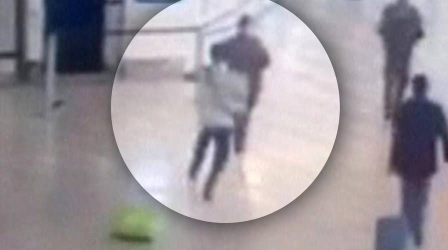 Moment man takes soldier hostage at airport caught on tape
