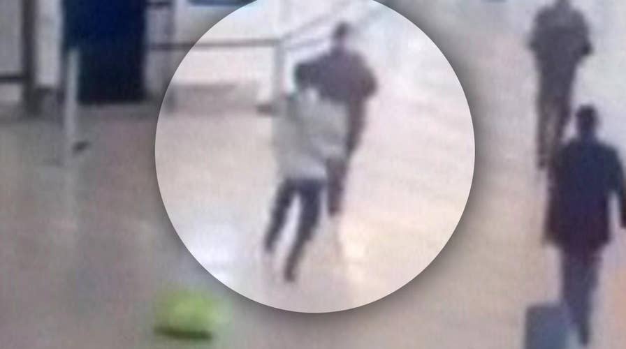 Moment man takes soldier hostage at airport caught on tape