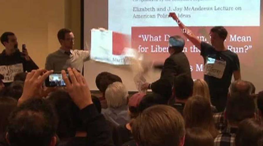 Liberal protesters shut down, hauled out of event