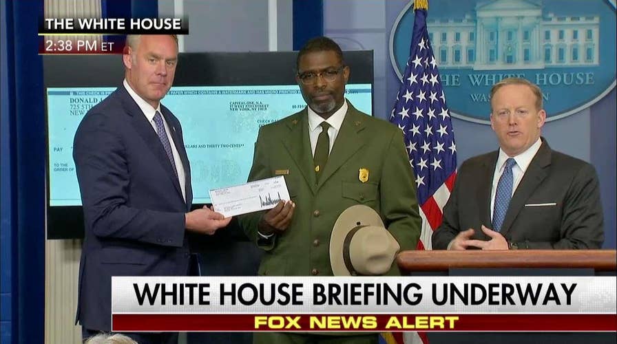 Zinke accepts check