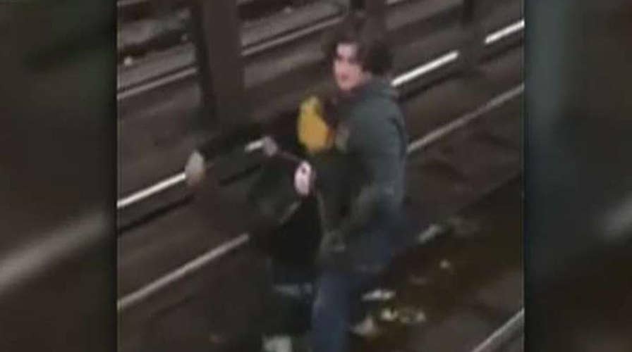Hero saves boy from NY subway tracks