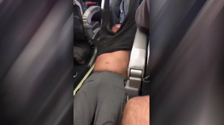 Police drag passenger from United Airlines plane