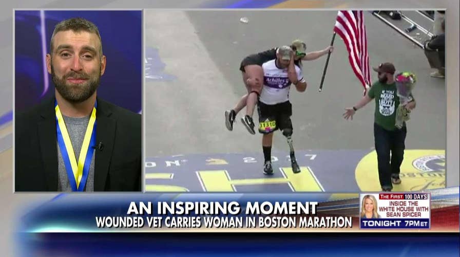 Wounded vet carries woman at Boston Marathon