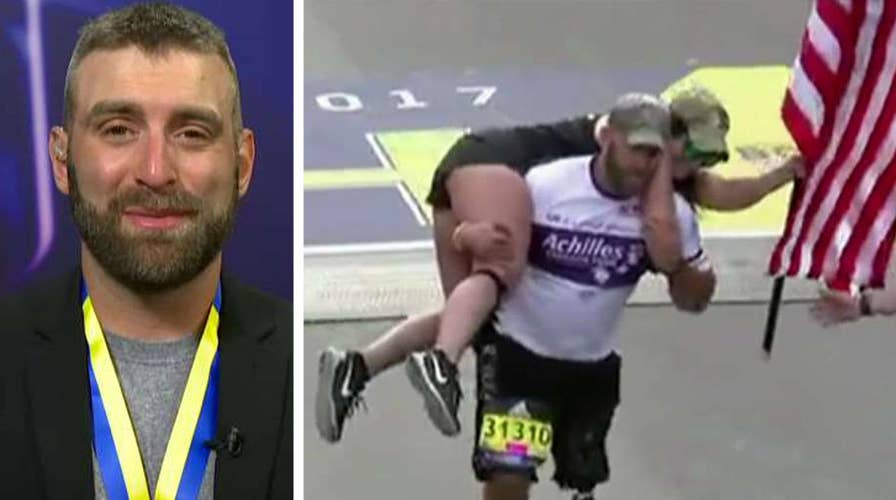 Wounded vet completes Boston Marathon with American flag