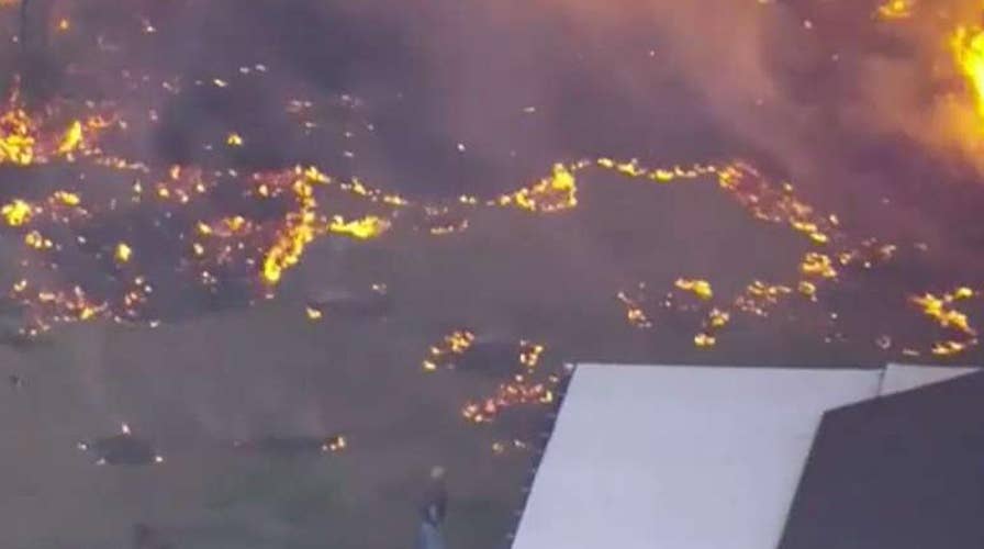 Florida residents evacuate as 'suspicious' fire spreads 