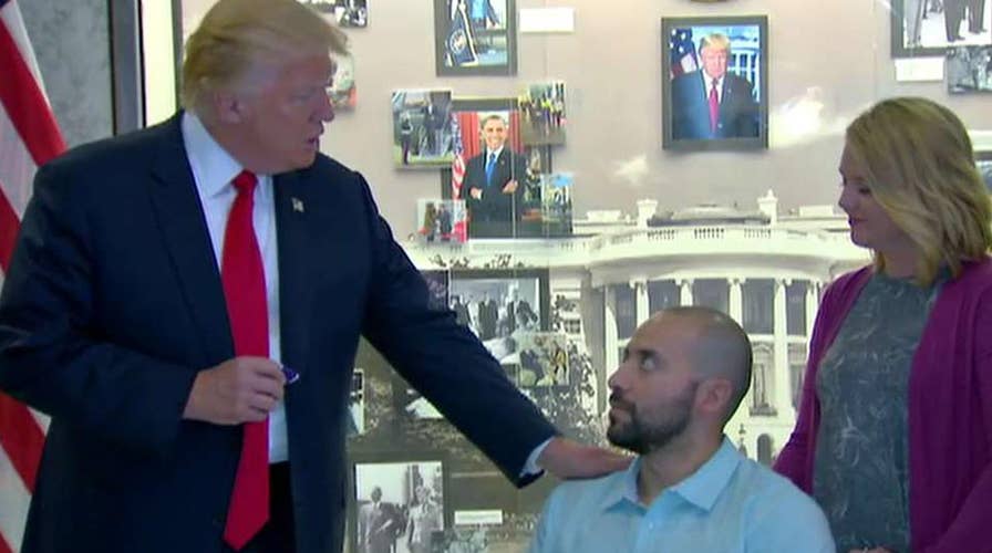 Trump visits Walter Reed hospital to award Purple Heart