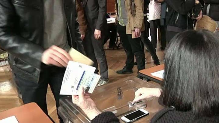 Voter turnout stronger than expected in French election 