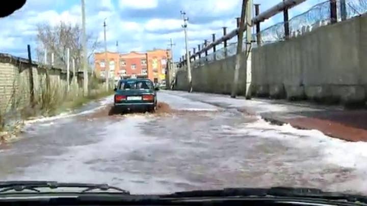 Fruit juice flash flood flows through street in Russia 