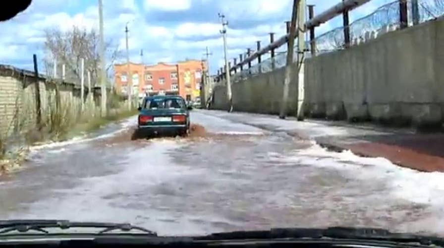 Fruit juice flash flood flows through street in Russia 