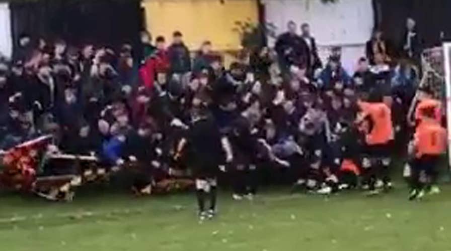 Soccer players crushed by fans celebrating goal
