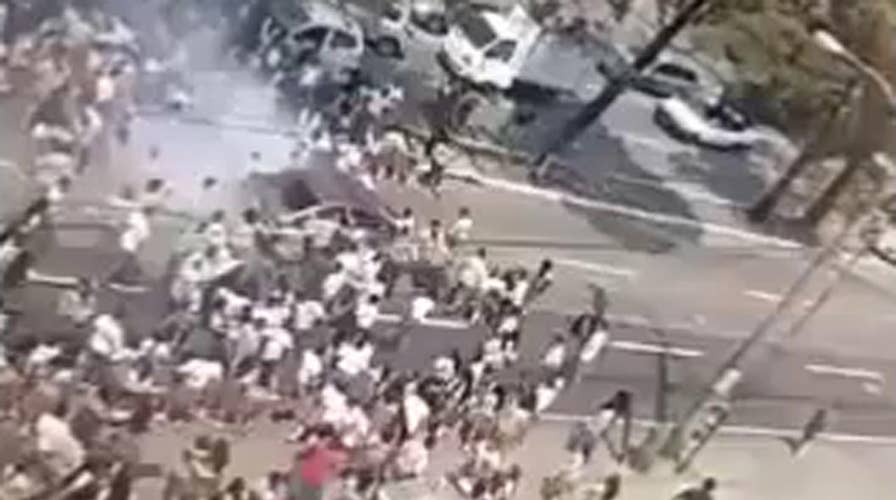Car runs over crowd of student protesters in Guatemala