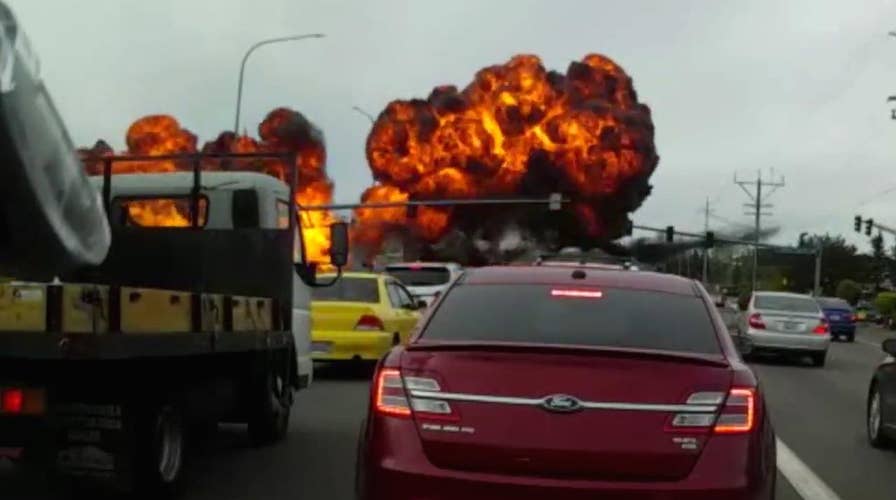 Dashcam captures terrifying plane crash on busy road