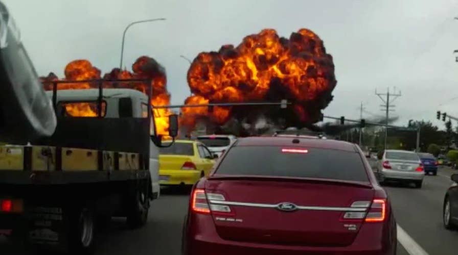 Dashcam captures terrifying plane crash on busy road