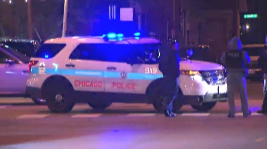 Massive manhunt for suspects after Chicago cops shot