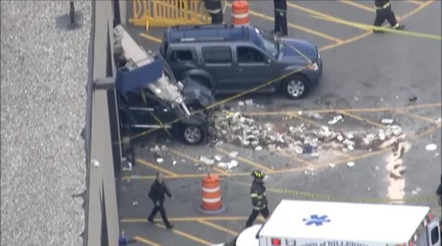 Car plows into crowd at Massachusetts auto auction