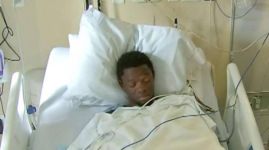 Boston double murder suspect faces judge from hospital room