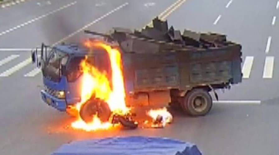 Warning, graphic content: Biker escapes fiery crash 
