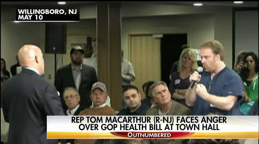 MacArthur faces angry town hall