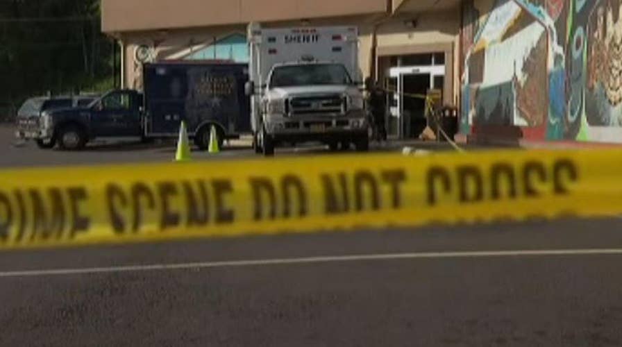 Man holding severed head stabs store employee