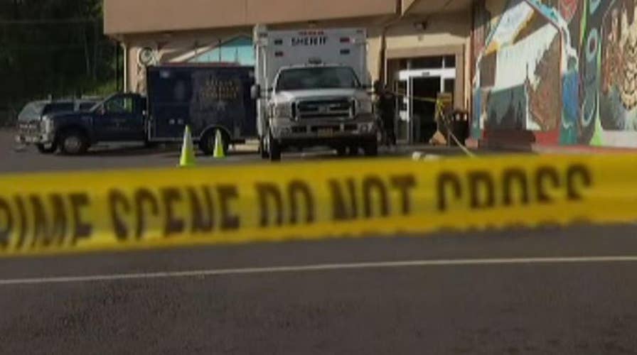 Man holding severed head stabs store employee 