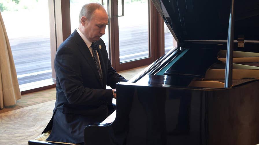 But does he know 'Chopsticks'? Putin shows off piano skills