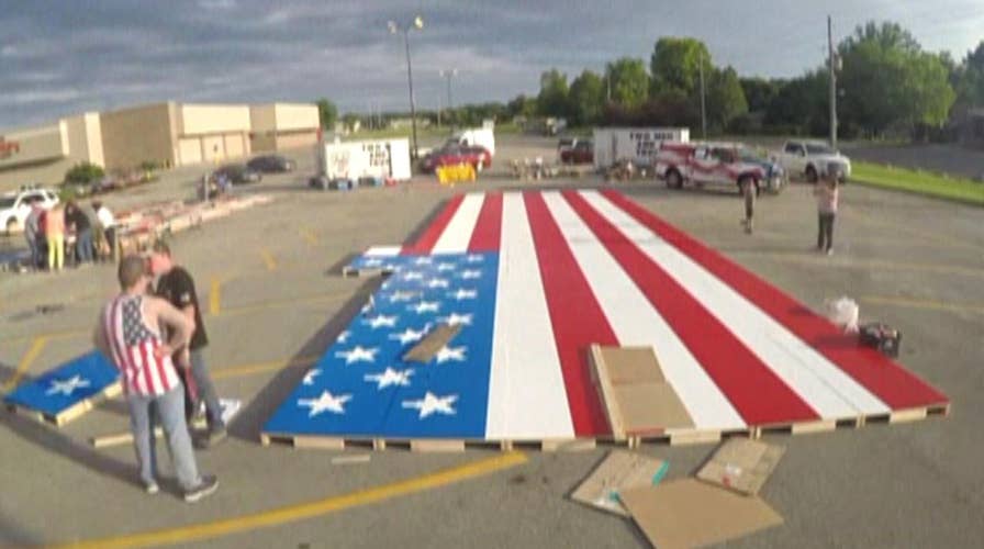 Watch volunteers assemble the world's largest Lego flag