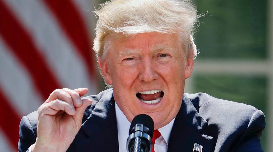 White House defends move to exit climate deal