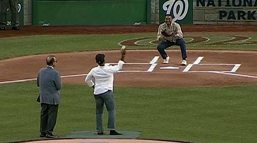 Injured officer throws first pitch at Congress' ball game