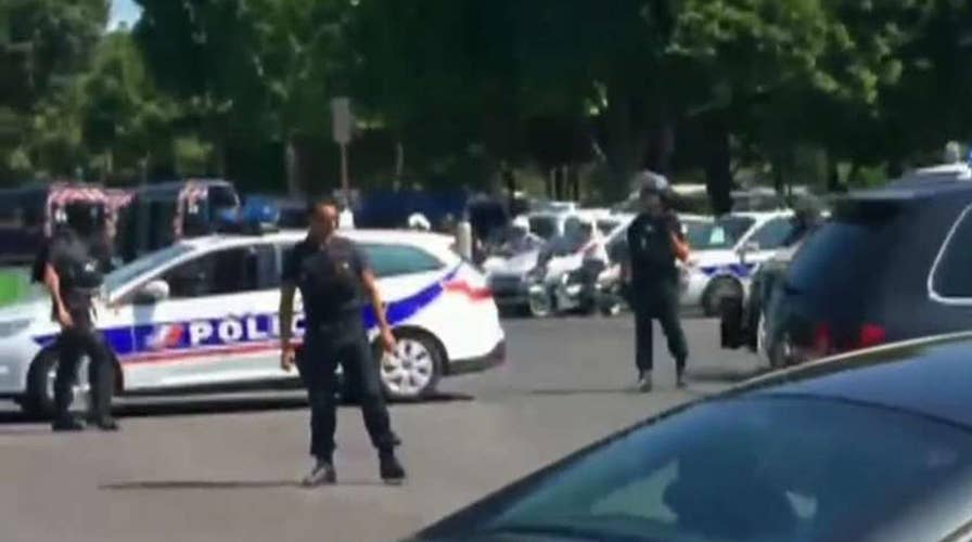 Suspect detained after driving into police car in Paris