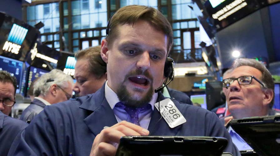 Dow rises more than 100 points, hits record high