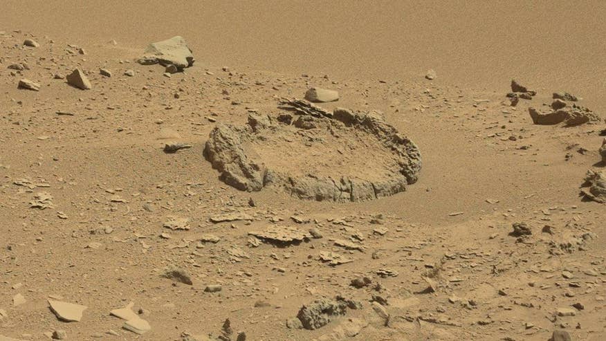 UFO hunters claim to have discovered what looks like a 'stone circle' on the surface of Mars. The image was captured by the NASA's Mars Curiosity rover