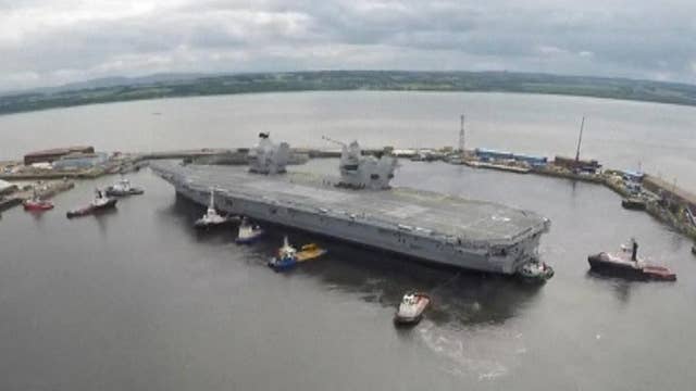 UK's largest warship puts to sea for maiden voyage