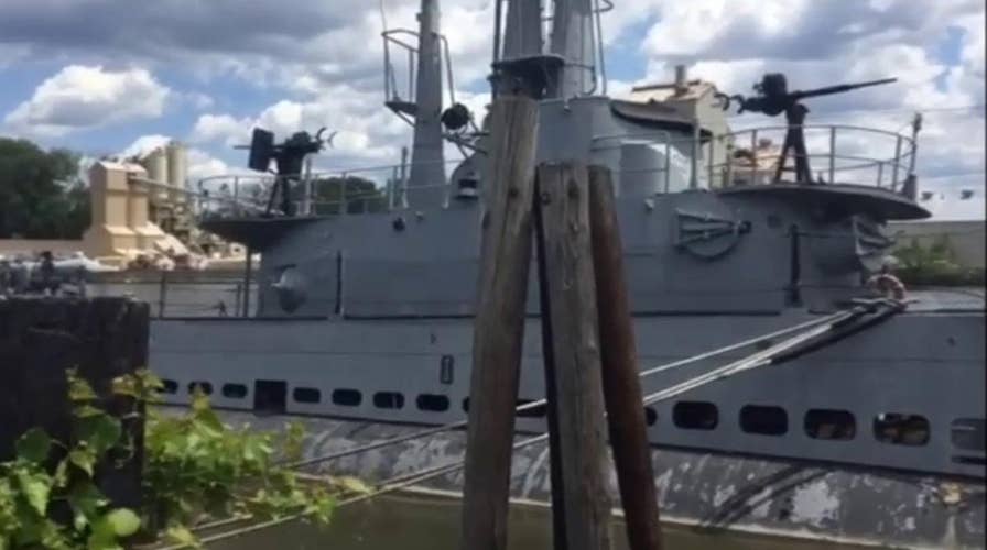 Can this WWII submarine stuck in river muck be saved?