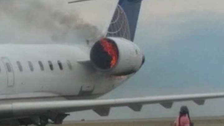 Plane engine bursts into flames on the tarmac