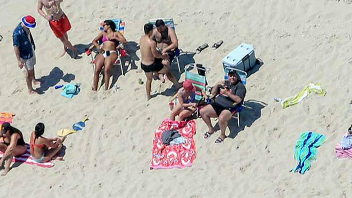 Firestorm over photo of Gov. Christie on closed NJ beach