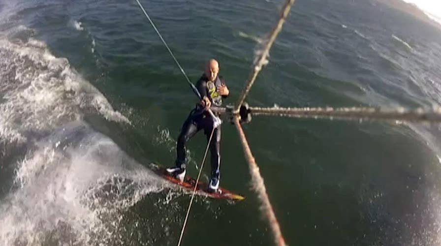 Whale stuns kite boarder