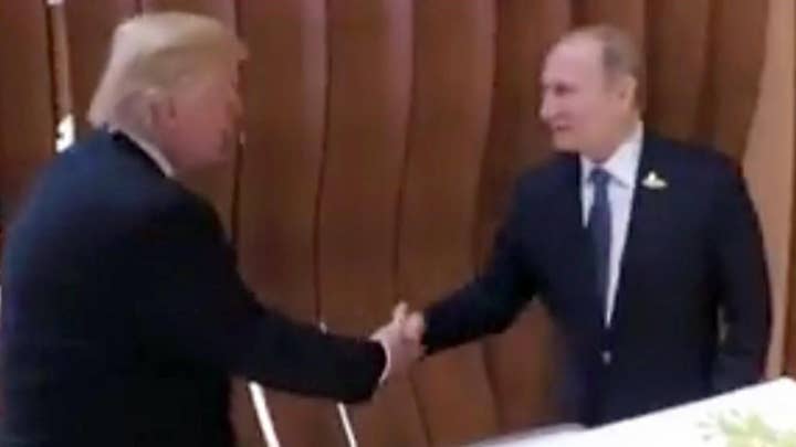 Triunfo, Putin shake hands ahead of highly anticipated meeting