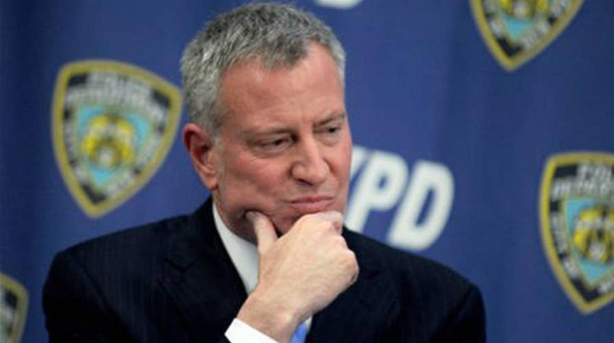 NYC mayor skips NYPD swearing-in ceremony to join protest