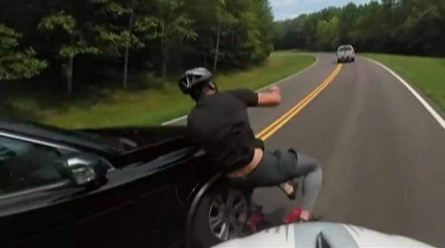Cyclist knocked to ground in hit-and-run caught on camera