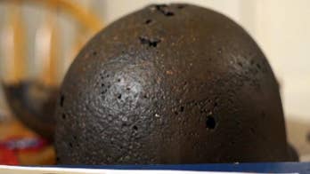 Minnesota woman reunited with father's WWII helmet found on Dutch battlefield