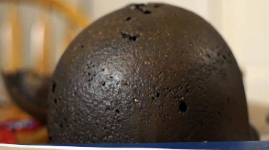Woman reunited with father's WWII helmet