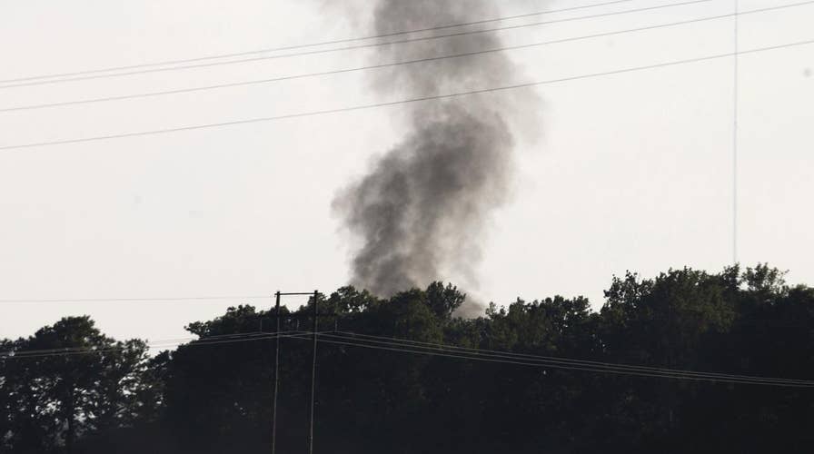 Officials try to determine what caused military plane crash