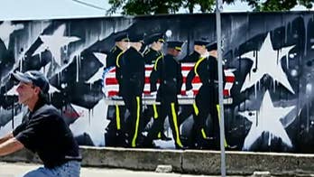 Outrage as Dallas officials threaten to tear down wall honoring fallen police officers because it 'runs afoul of regulations'