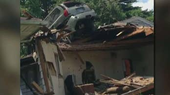 Car crashes into roof of St. Louis home
