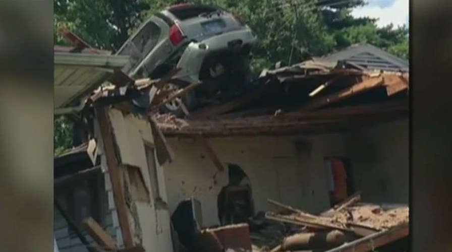 Car crashes onto the roof of St. Louis home